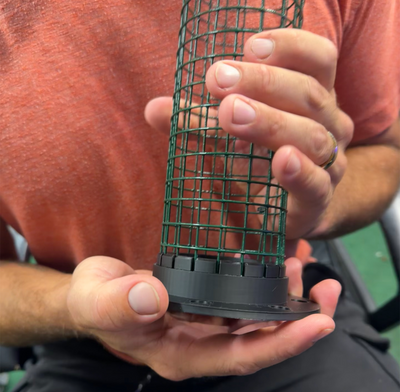 Close-up of hands assembling wire cage for the DIY plant support kit with a secure and easy-to-use design.